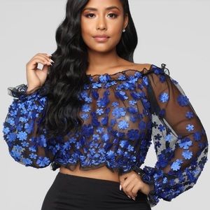 Sheer crop top. Blue flower decor.